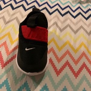 Red, black and white Nike shoes.